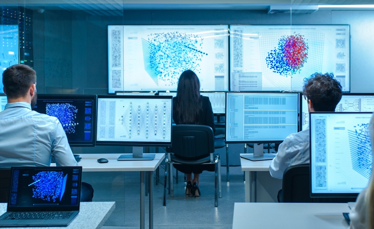 Engineers working on computer screens