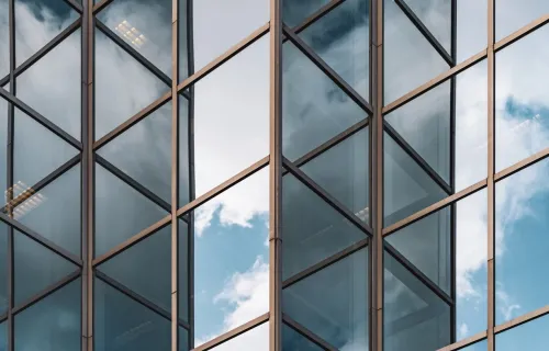 clouds reflected in building windows