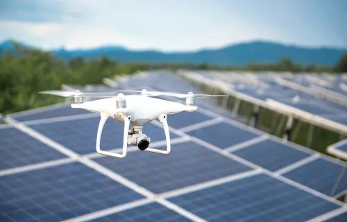Drone flying over solar pannels